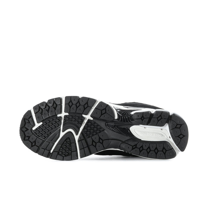 Men's black outsole with white traction areas and textured rubber tread