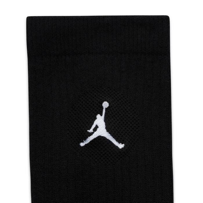 Black crew sock close-up with white Jordan logo on knit cuff