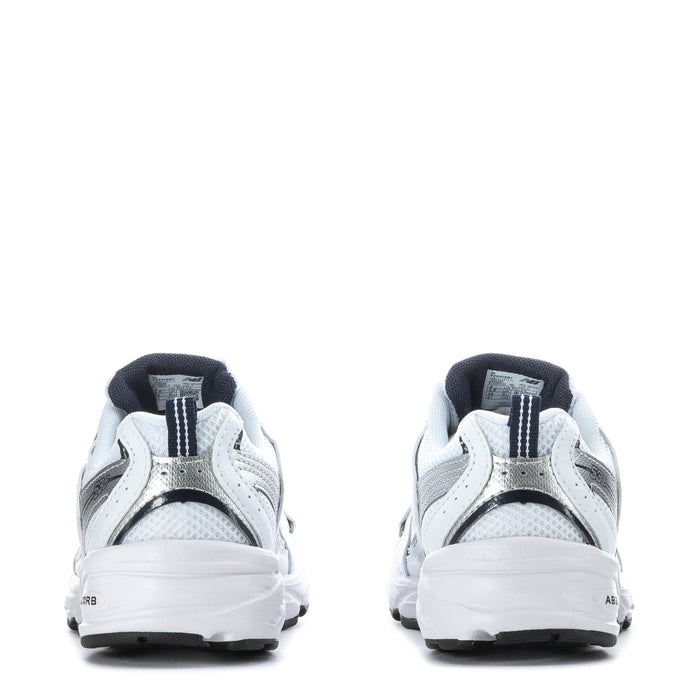 Kids white sneakers heel view with navy trim, cushioned collar and lace-up
