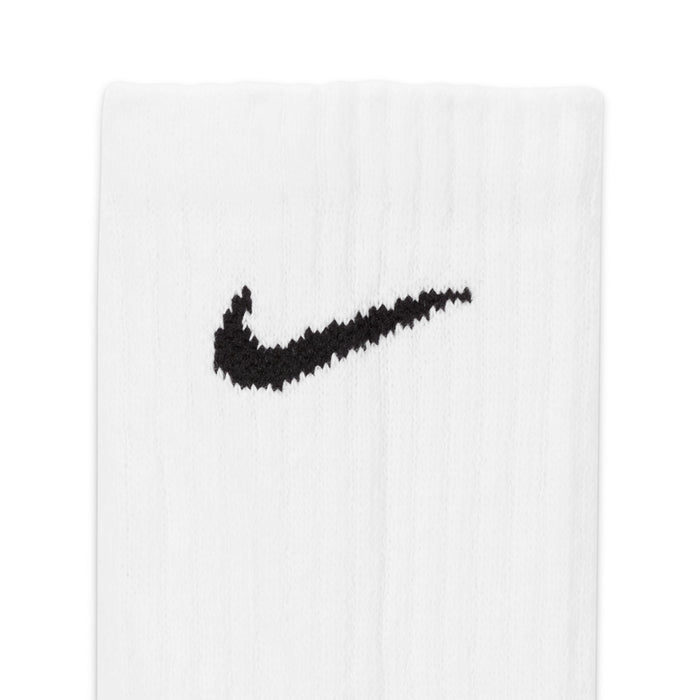 White crew sock with black Nike Swoosh logo, cushioned knit