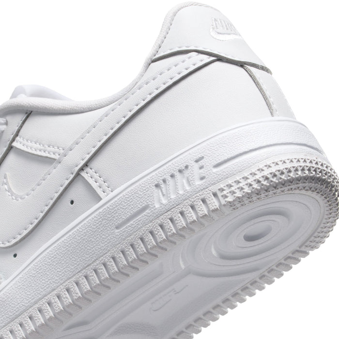 Kids' sneaker close-up of sidewall and outsole with Nike branding and tread