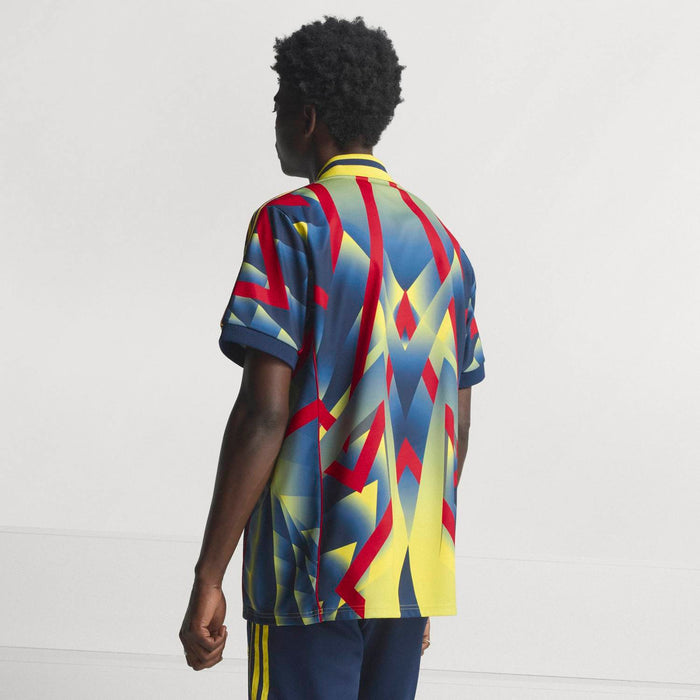 Men's multicolor jersey back with yellow collar trim and geometric graphics
