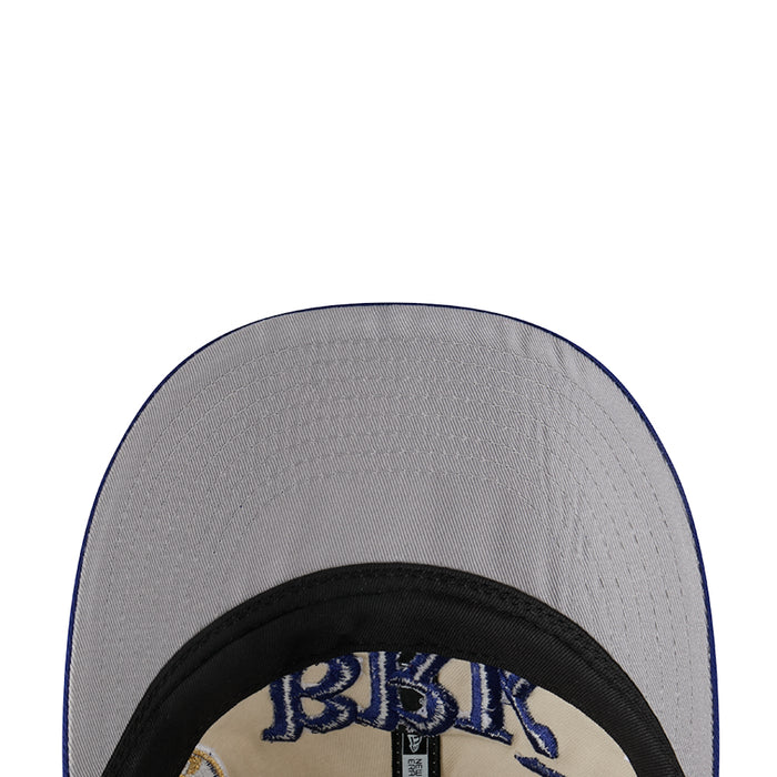Grey baseball cap close-up with embroidered Brooklyn Dodgers text and black brim