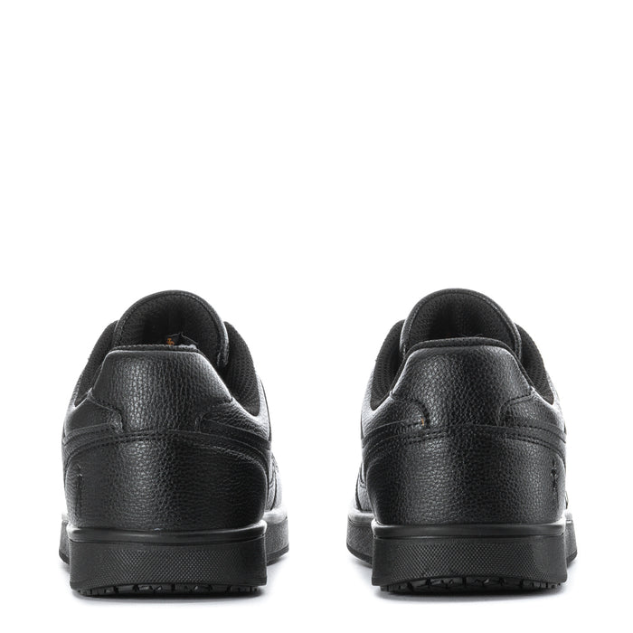 Black low-top sneakers with rear tab, cushioned collar, and rubber outsole