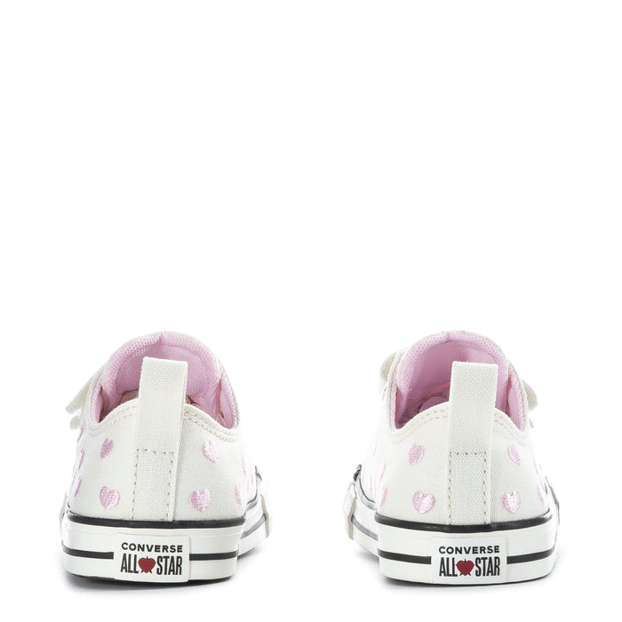 Toddler low-top sneakers back view, white canvas with pink hearts, Converse All Star logo