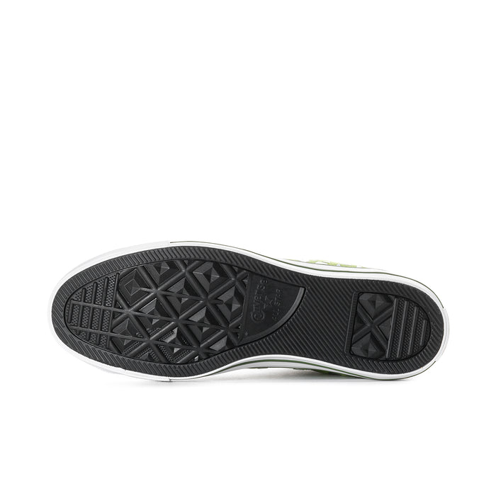Outsole view of bright green high-top sneakers with black tread and white midsole