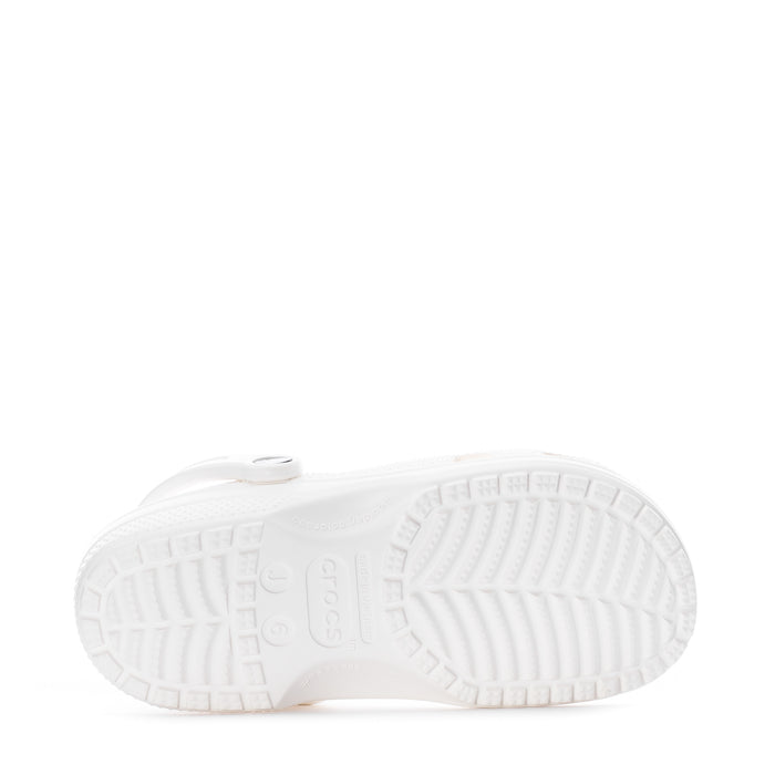 Youth white clog outsole view with textured tread and molded traction pattern.