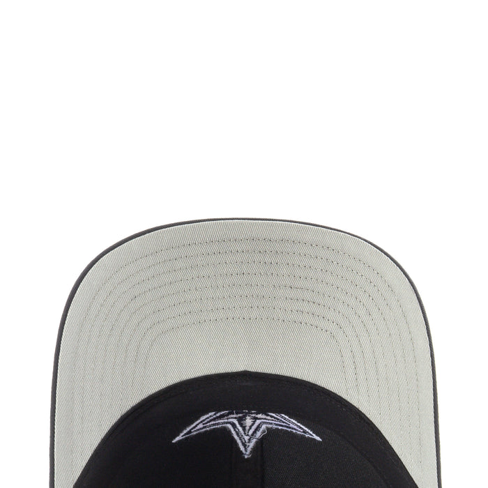 Light gray and black trucker hat brim close-up with stitched panels