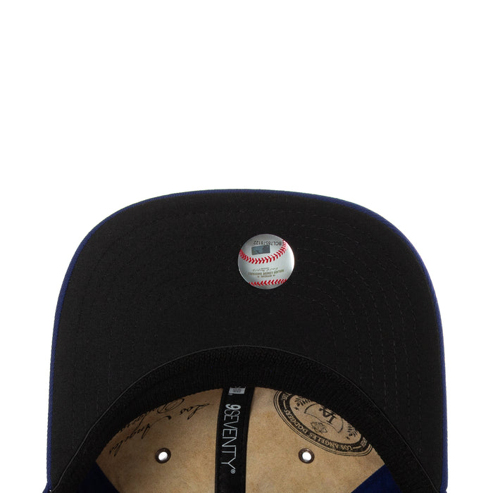 Black baseball cap with small baseball emblem on the crown
