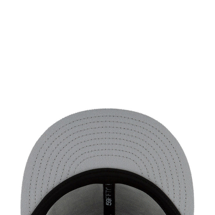 Baseball cap brim close-up with black trim and stitched panels