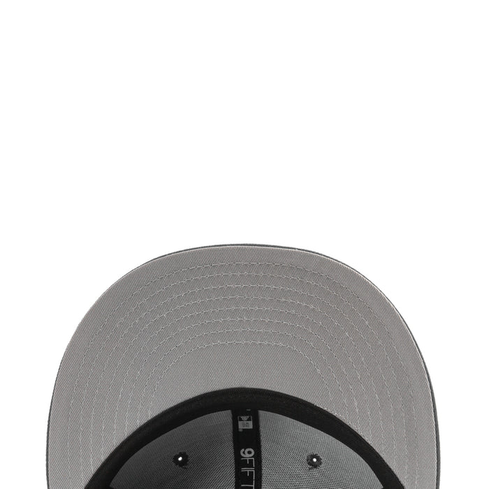 Gray cap interior panel with black inner band and eyelets under the brim