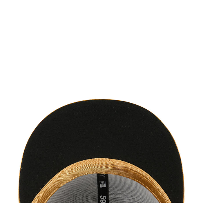 Black cap interior close-up with gold stitched trim edge
