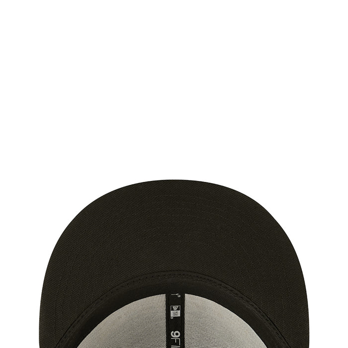 Dark baseball cap top view showing textured fabric and stitched crown seam