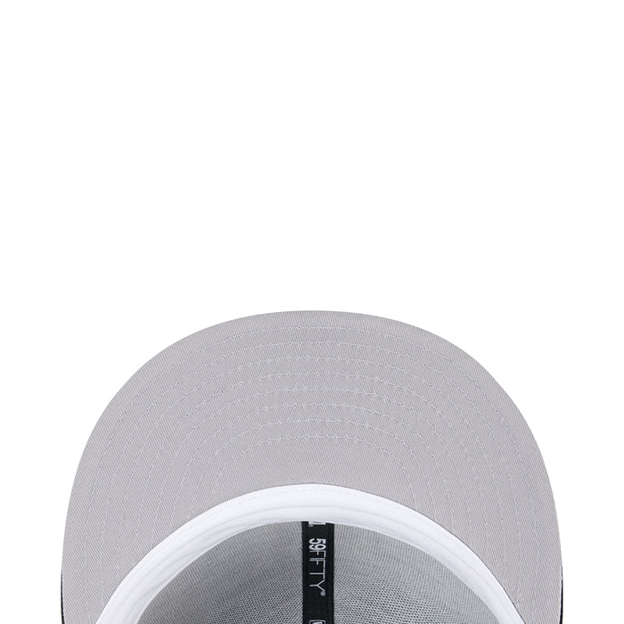 Grey baseball cap interior with white brim and vertical New Era label