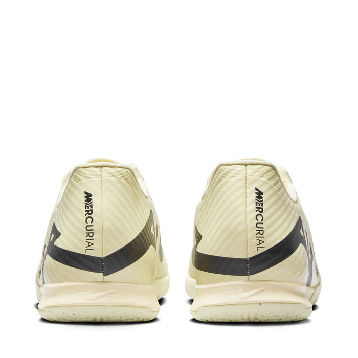 Men's cream soccer cleats rear view with black heel stripe and Mercurial text