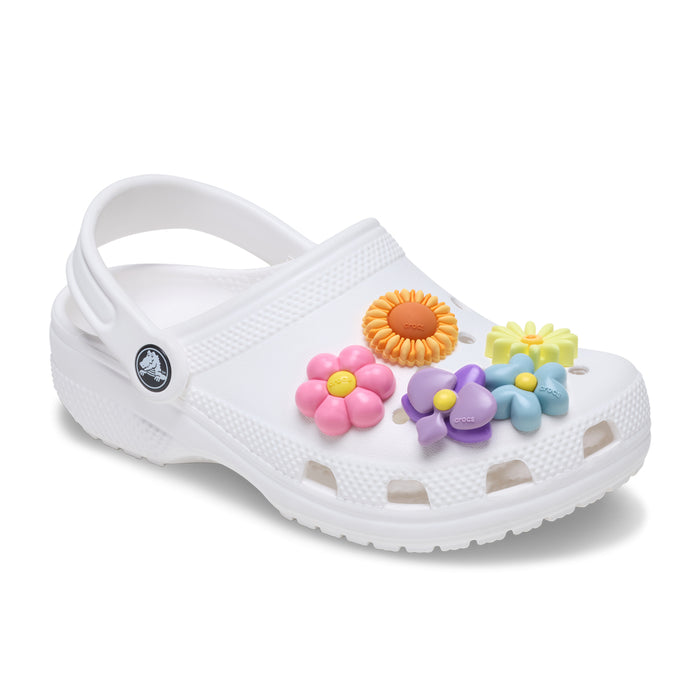 Puffy flower Jibbitz charms on white clog: pink, orange, yellow, purple, and blue flowers