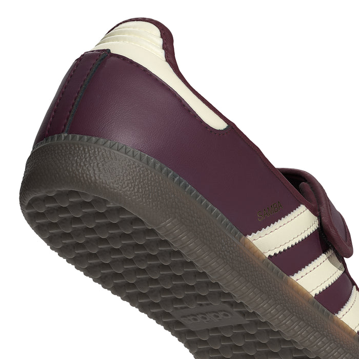 Women's maroon sneaker side view with cream stripes and textured platform sole