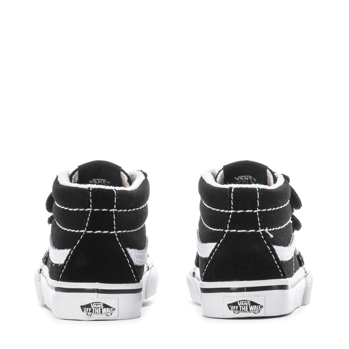 Back view of black toddler mid-top sneakers with white stitching and padded collar