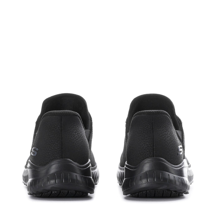 Black sneakers with cushioned heel and chunky treaded sole, rear view