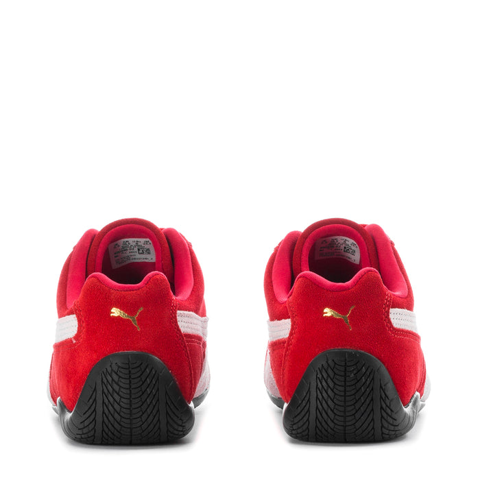 Red and white women's sneakers with heel tabs and textured rubber soles
