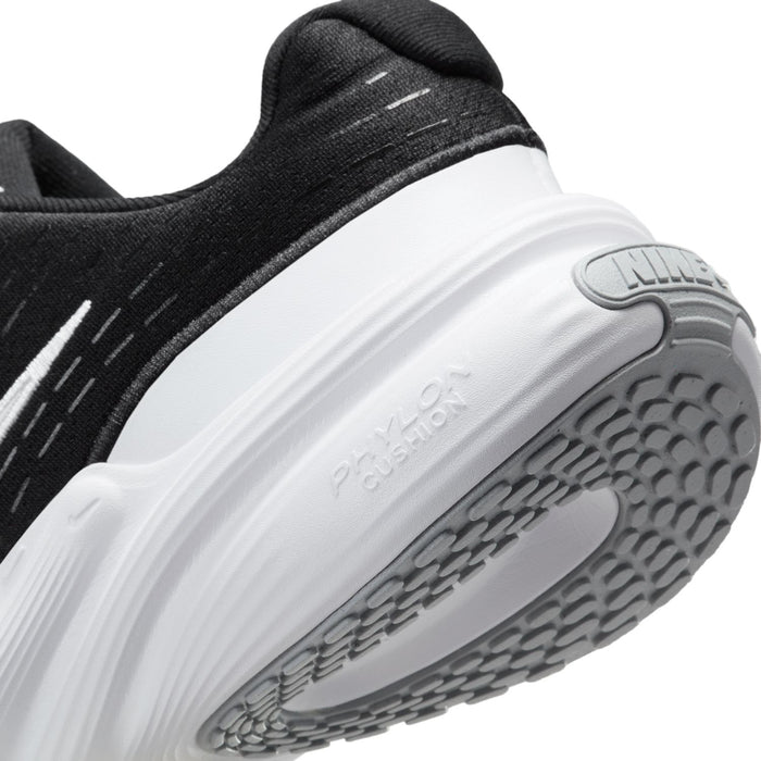 Close-up of black upper and white outsole tread on women's running sneaker
