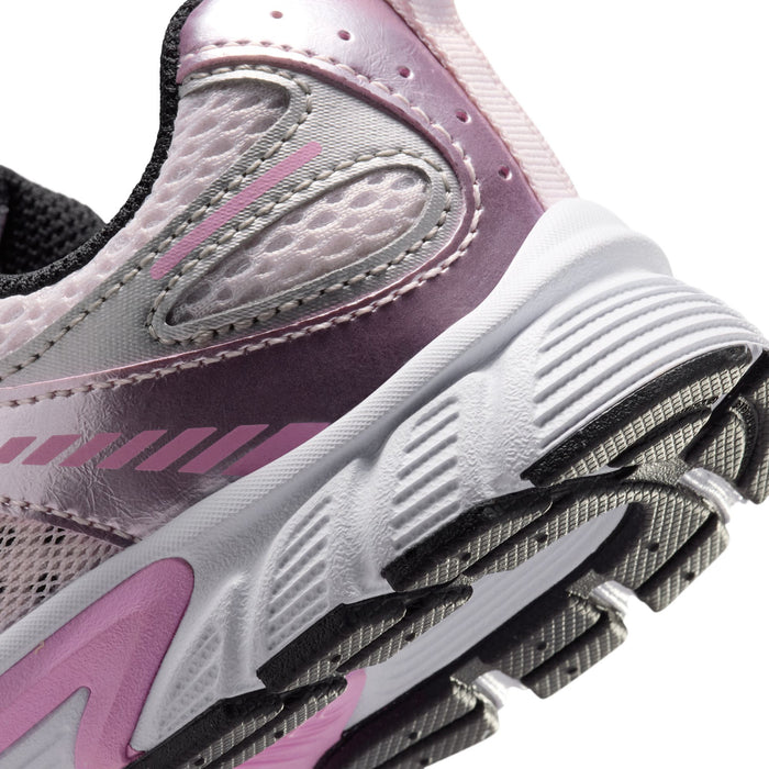 Close-up of kids sneaker heel and sole with gray, pink trim, and tread pattern