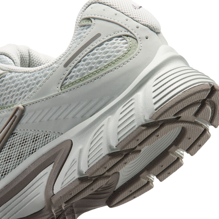 Men's shoe close-up, light silver mesh with ribbed midsole and textured outsole