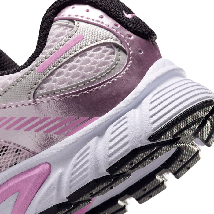 Youth running shoe heel close-up, pink and metallic silver with black tread on outsole