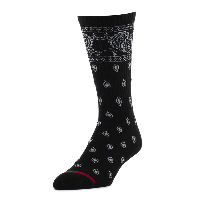 Black crew socks with repeating light patterned motifs