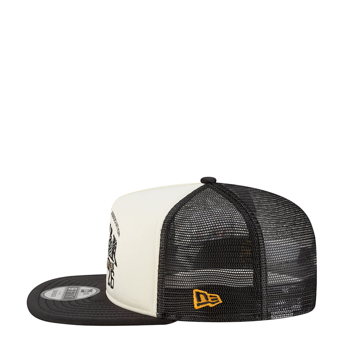 Two-tone A-frame trucker cap with white panels and black mesh side, embroidered badge