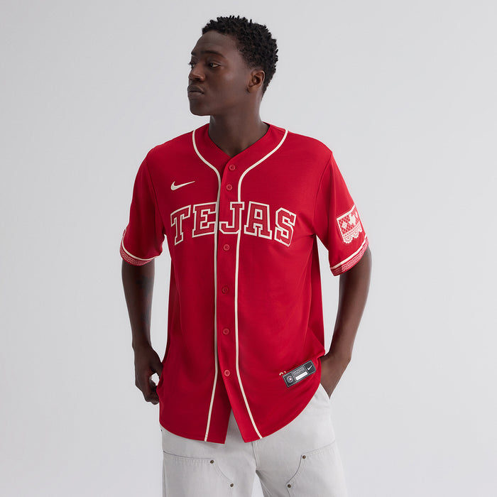 Men's red baseball jersey with 'TEJAS' chest logo, cream piping and Nike swoosh