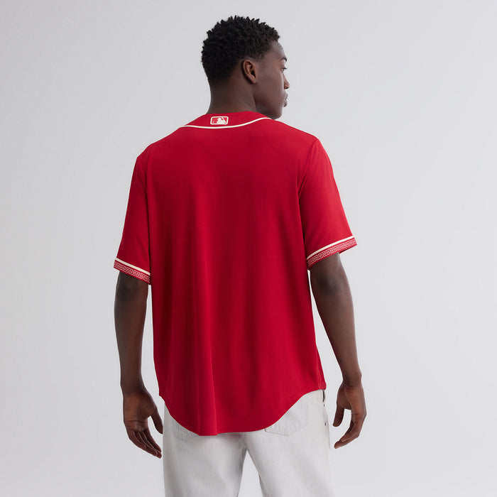 Red baseball jersey with cream collar and sleeve stripe detail, back view