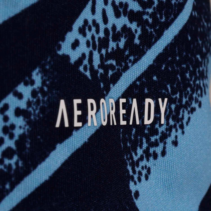 Navy soccer jersey detail with light-blue diagonal stripe and “AEROREADY” logo