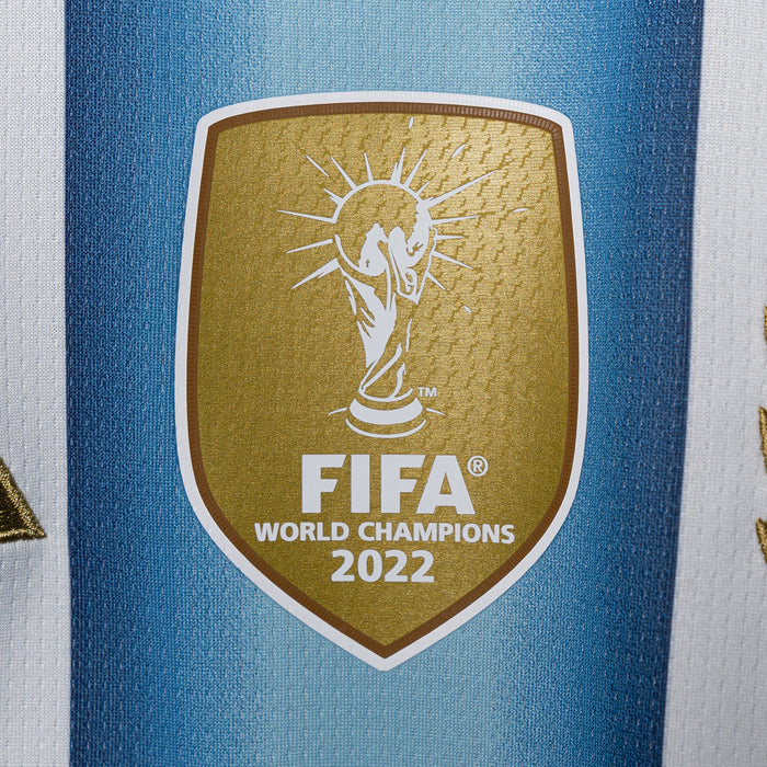 Close-up FIFA World Champions 2022 crest on light blue jersey fabric