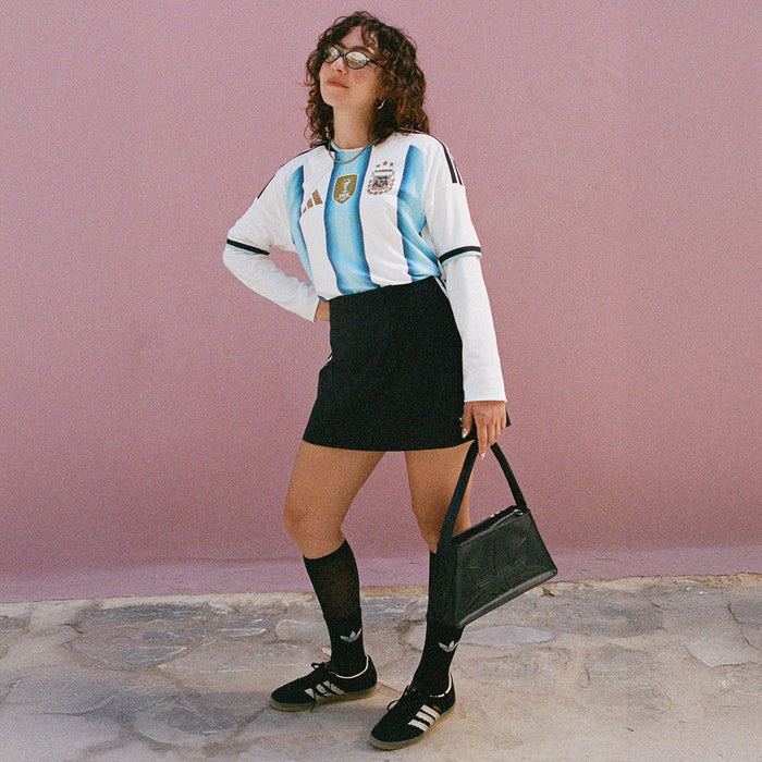 Mens Argentina replica jersey with white and light blue stripes, worn with black shorts
