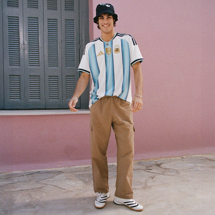 Mens Argentina striped jersey worn with tan pants and sneakers