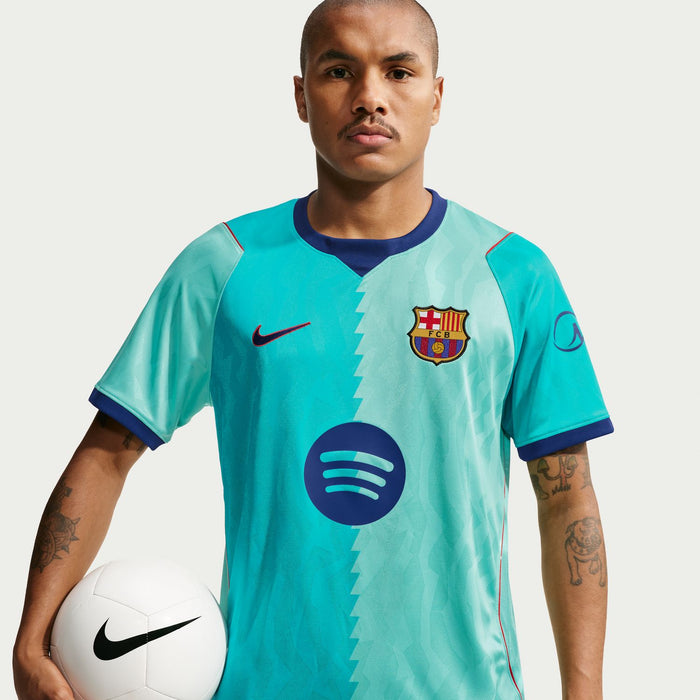 Men's teal soccer jersey with FC Barcelona crest, diagonal pattern, and Nike swoosh