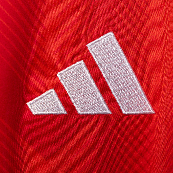 Adidas logo on red jersey chest in white