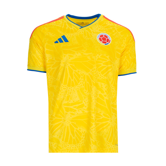 Mens yellow home soccer jersey with blue trim, Colombia crest, and subtle geometric pattern