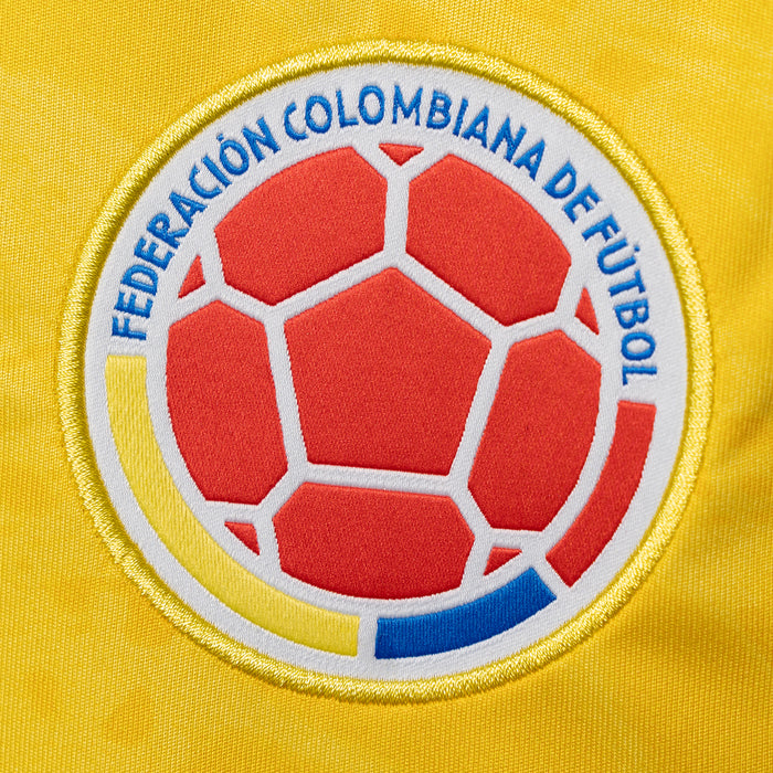 Close-up of Colombia soccer crest on yellow jersey