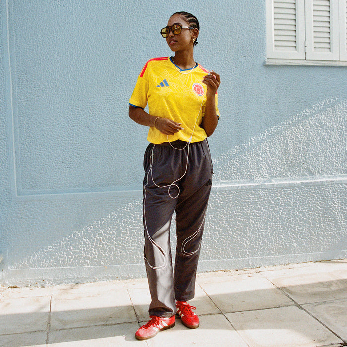 Mens yellow Colombia replica soccer jersey with blue collar trim and matching crest