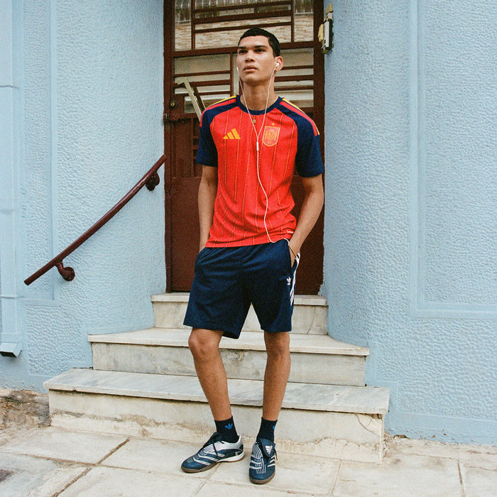 Men's Spain home replica jersey in vivid red with navy shoulders and vertical pinstripes