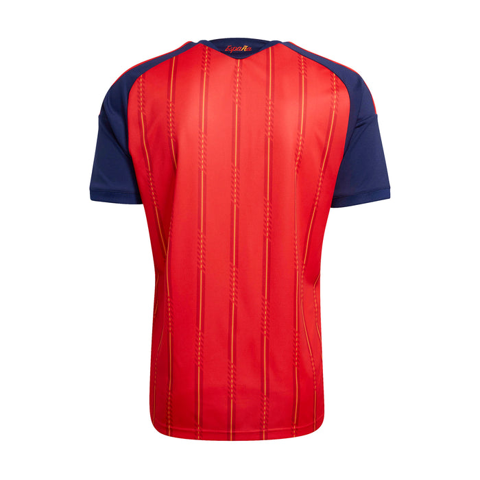 Back view of Spain replica home jersey in vivid red with navy sleeves and vertical seams