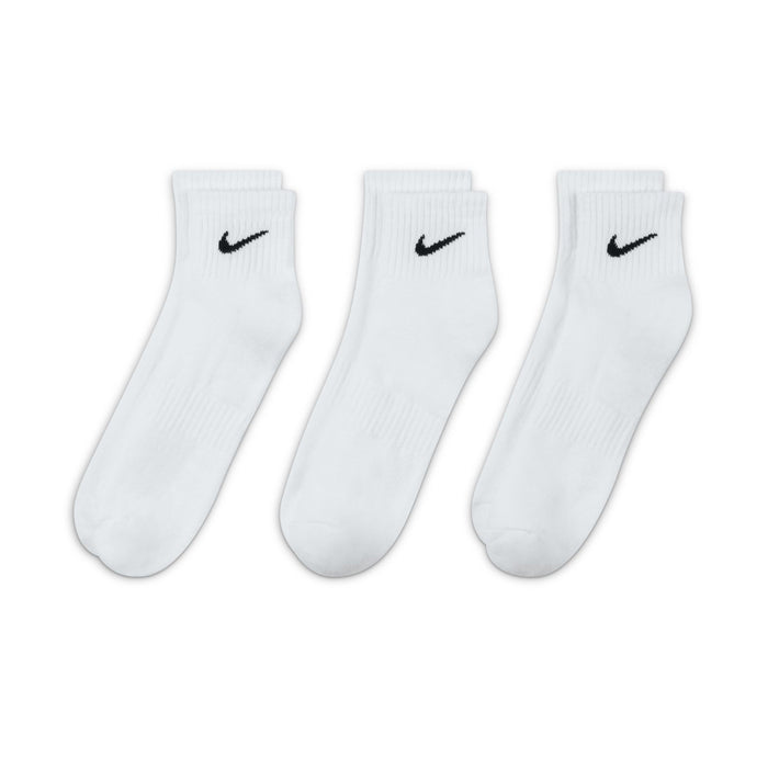 Three-pack white crew socks with black Nike swooshes, cushioned