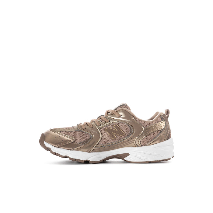 Kids beige lace-up athletic sneakers, angled side profile with N logo and white sole