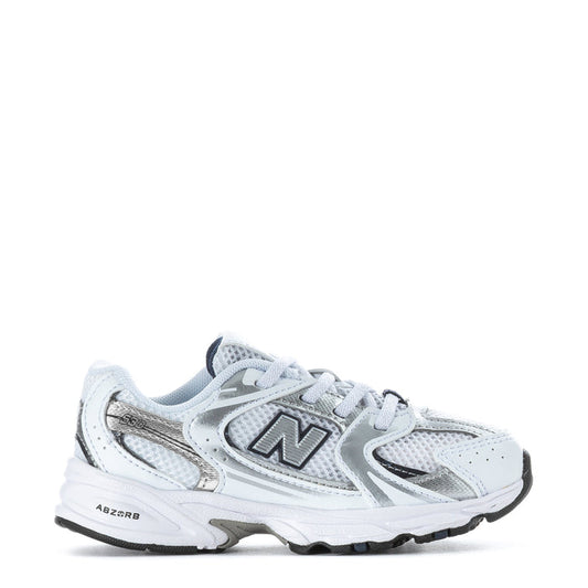 Toddler white and navy New Balance sneaker with lace-up and N logo, gray sole
