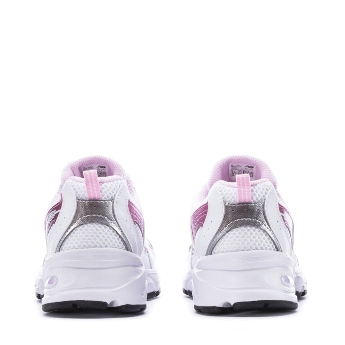 Youth sneaker heel view in white with pink accents, lace-up closure