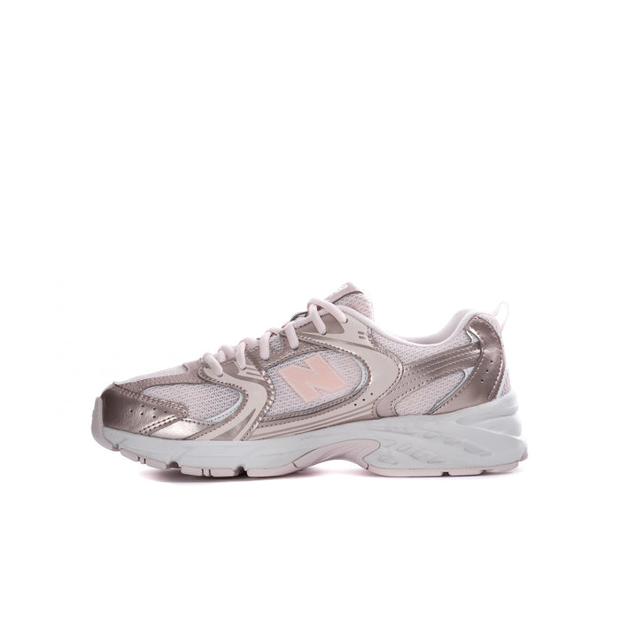 Youth light pink and metallic silver sneaker with N logo and lace-up closure.