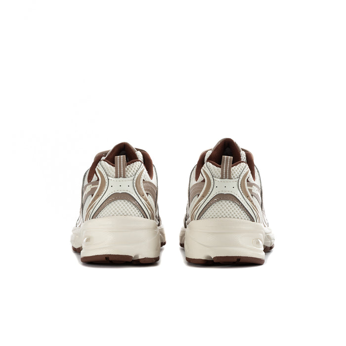 Women's 530 wide sneakers heel view with padded collar and brown outsole