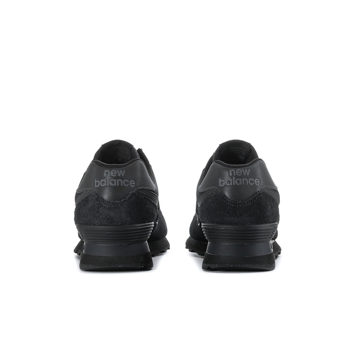 Men's New Balance 574 sneakers in black, heel view with 'new balance' branding.